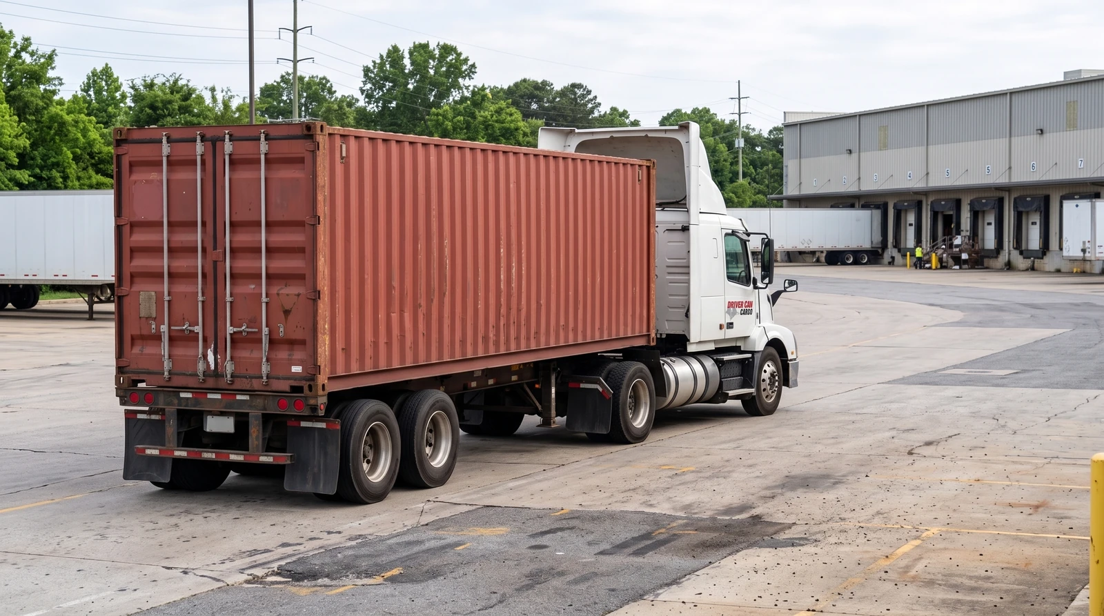 White Volvo tractor with a raised white roof fairing and a dry container.