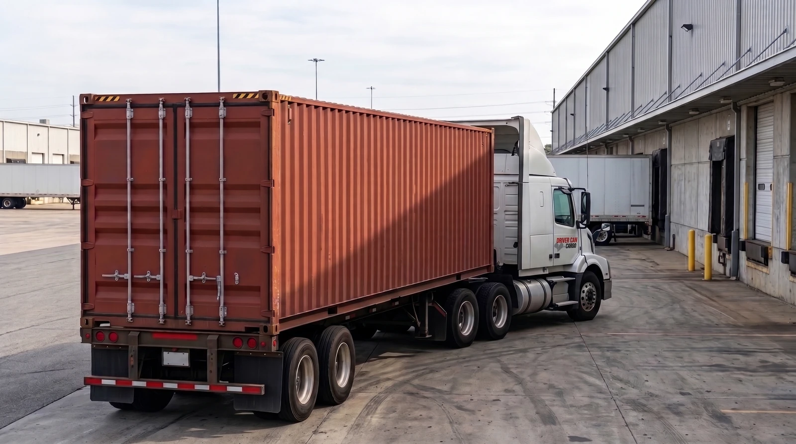 White Volvo tractor with a raised white roof fairing and a dry container.